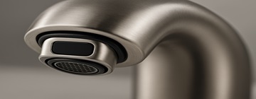 Close-up of faucet outlet components and sensor window
